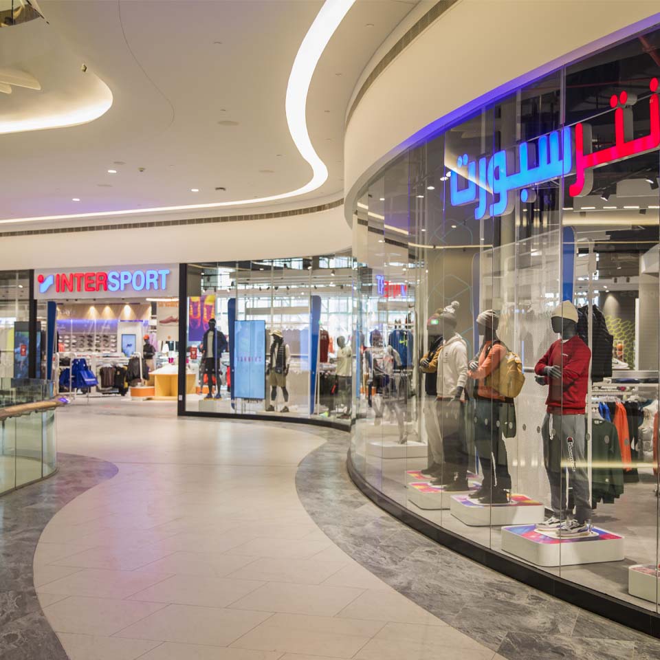 Desert cleanup volunteers in purple shirts walking across desert terrain