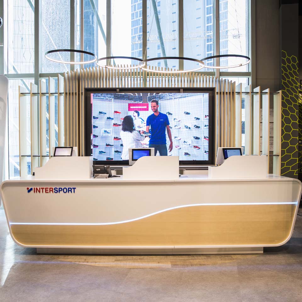 Desert landscape with cleanup volunteers and collection points visible in distance