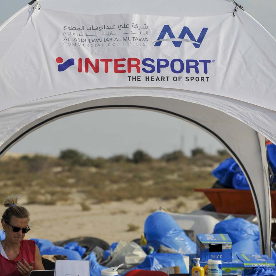 Team of volunteers working together to clean up desert area
