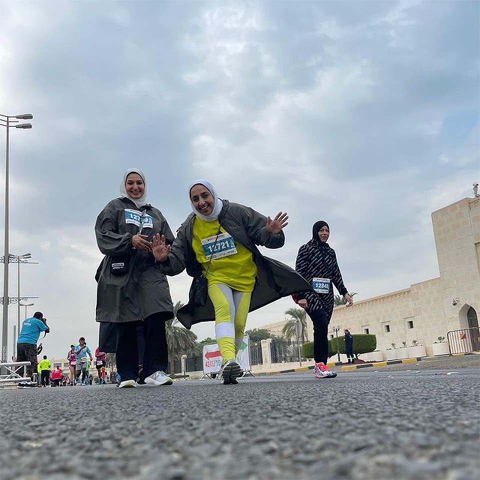 Intersport sponsored cleanup station with volunteers organizing collected waste