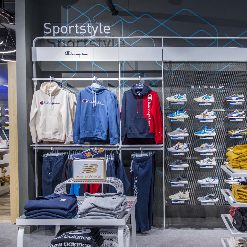 Intersport sponsored cleanup station with volunteers organizing collected waste